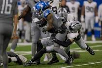 Raiders linebacker Robert Spillane (41) tackles Detroit Lions running back Jahmyr Gibbs (26) du ...