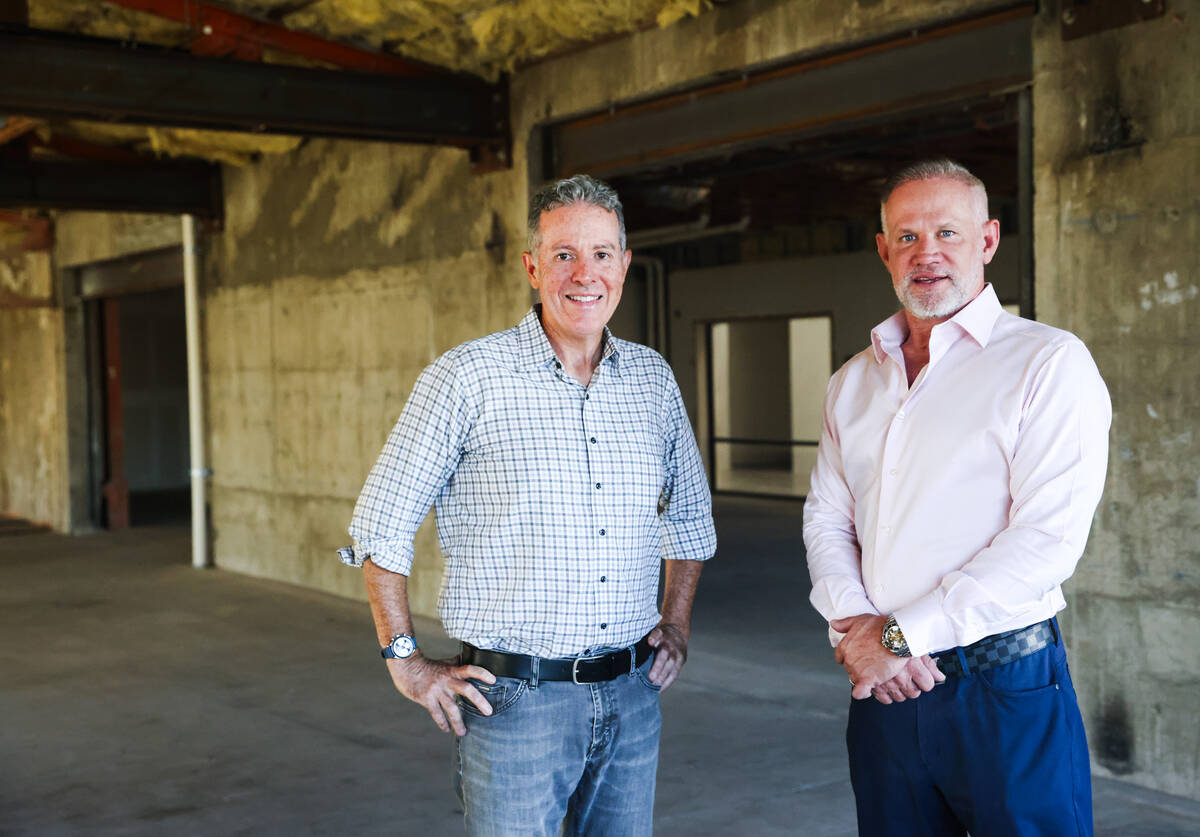 Jonathan Schwartz, left, president of Miltson Consulting who owns The Office, a renovated bank ...
