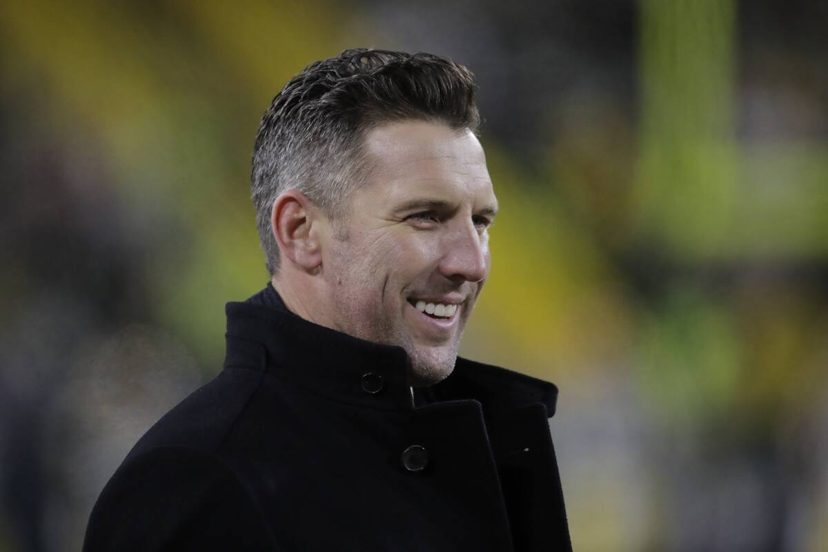 San Francisco 49ers assistant general manager Adam Peters watches warm ups before an NFC divisi ...