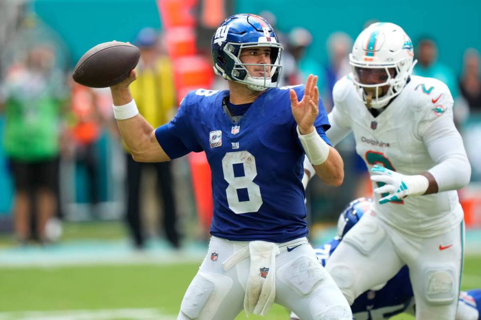 New York Giants quarterback Daniel Jones (8) aims a pass during the second half of an NFL footb ...