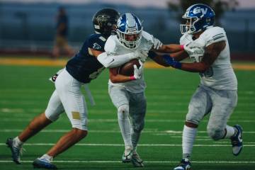 Green Valley wide receiver Ben Byington (19) carries the ball during a game against Foothill at ...