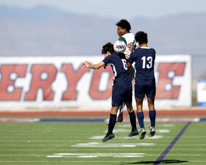 Palo Verde’s Ajani Smith (4) goes up for a header against Coronado’s Dalton Meusy ...