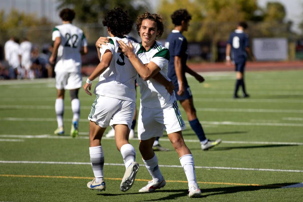 Palo Verde’s Noah Colindres (3) and Francesco Traniello (10) celebrate a goal during the ...