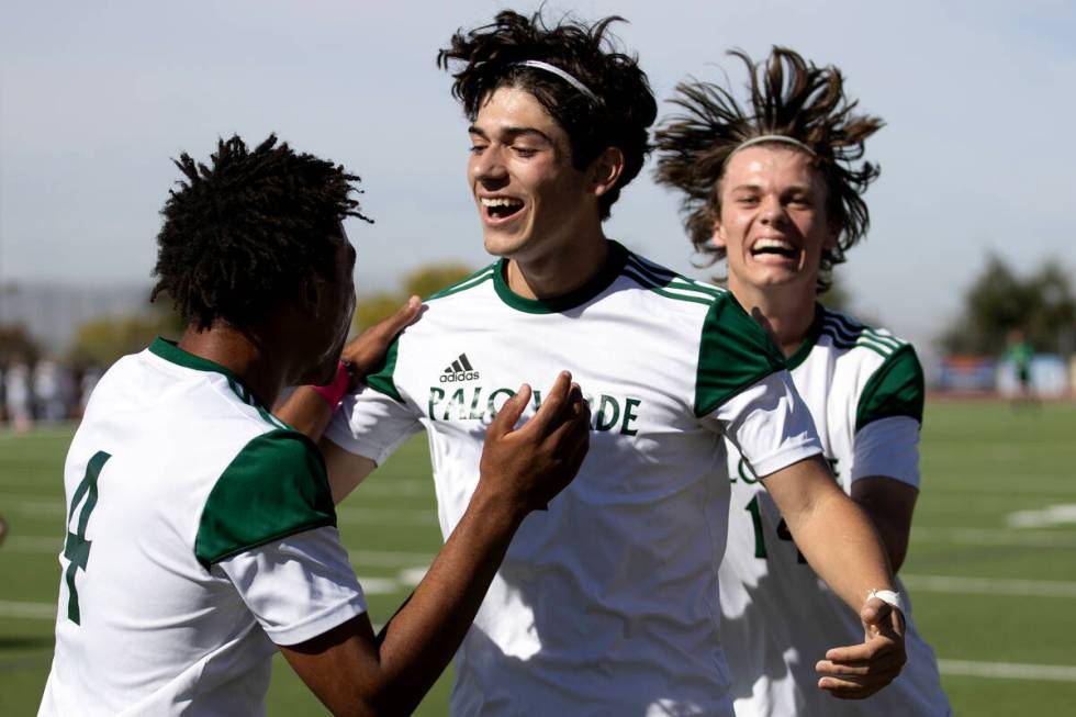 Palo Verde’s Ajani Smith (4), Justin Geracci (11) and Evan Odle (14) celebrate a goal du ...