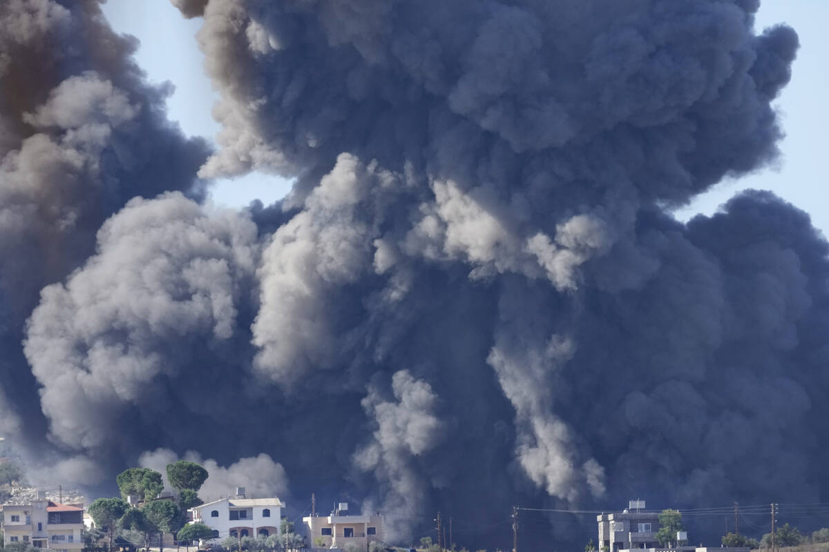 Black smoke rises from an Israeli airstrike on the outskirts of Aita al-Shaab, a Lebanese borde ...