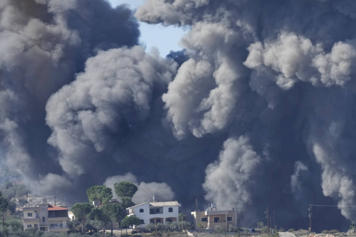 Black smoke rises from an Israeli airstrike on the outskirts of Aita al-Shaab, a Lebanese borde ...