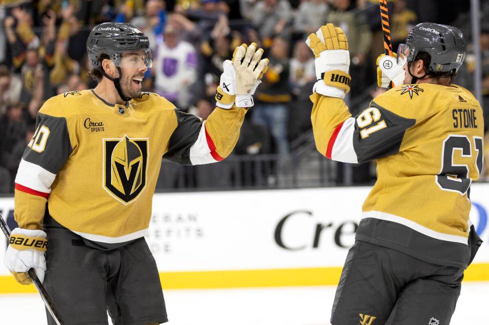 Golden Knights center Chandler Stephenson (20) and right wing Mark Stone (61) celebrate their g ...