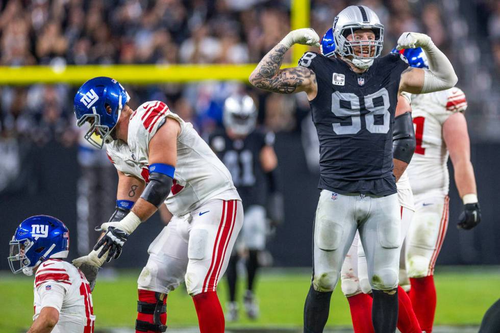 Vegas Raiders defensive end Maxx Crosby (98) flexes after New York Giants quarterback Tommy DeV ...