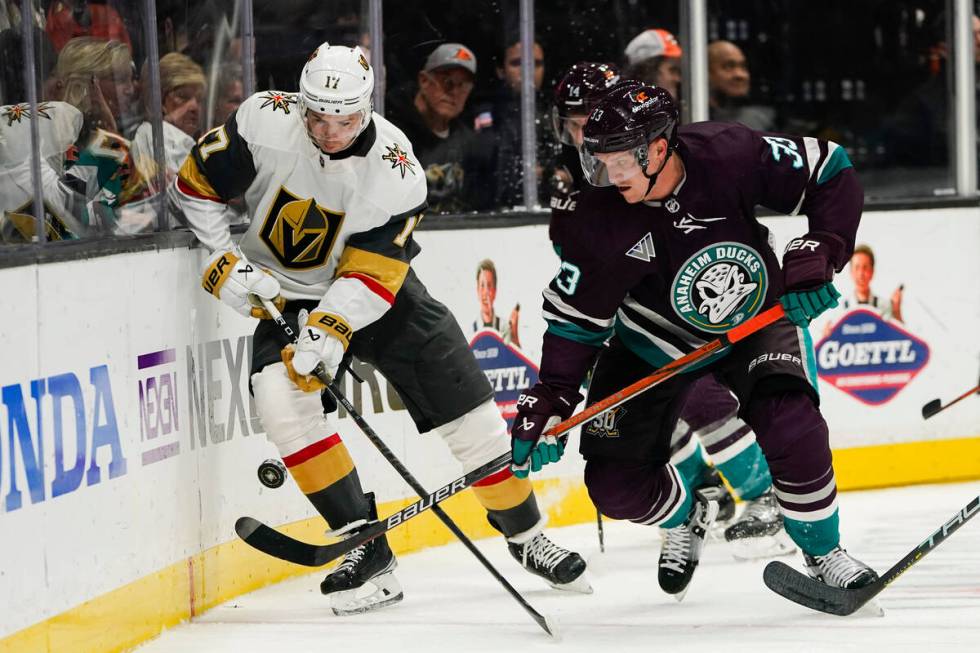 Vegas Golden Knights defenseman Ben Hutton, left, and Anaheim Ducks right wing Jakob Silfverber ...