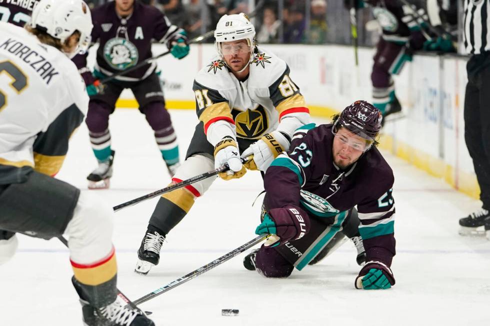 Anaheim Ducks center Mason McTavish, right, Vegas Golden Knights right wing Jonathan Marchessau ...