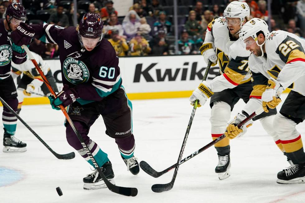 Anaheim Ducks defenseman Jackson LaCombe (60), Vegas Golden Knights center William Karlsson (71 ...