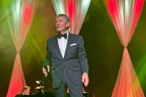 Bob Anderson performs during a wedding vow-renewal ceremony for nearly 300 couples as Las Vegas ...