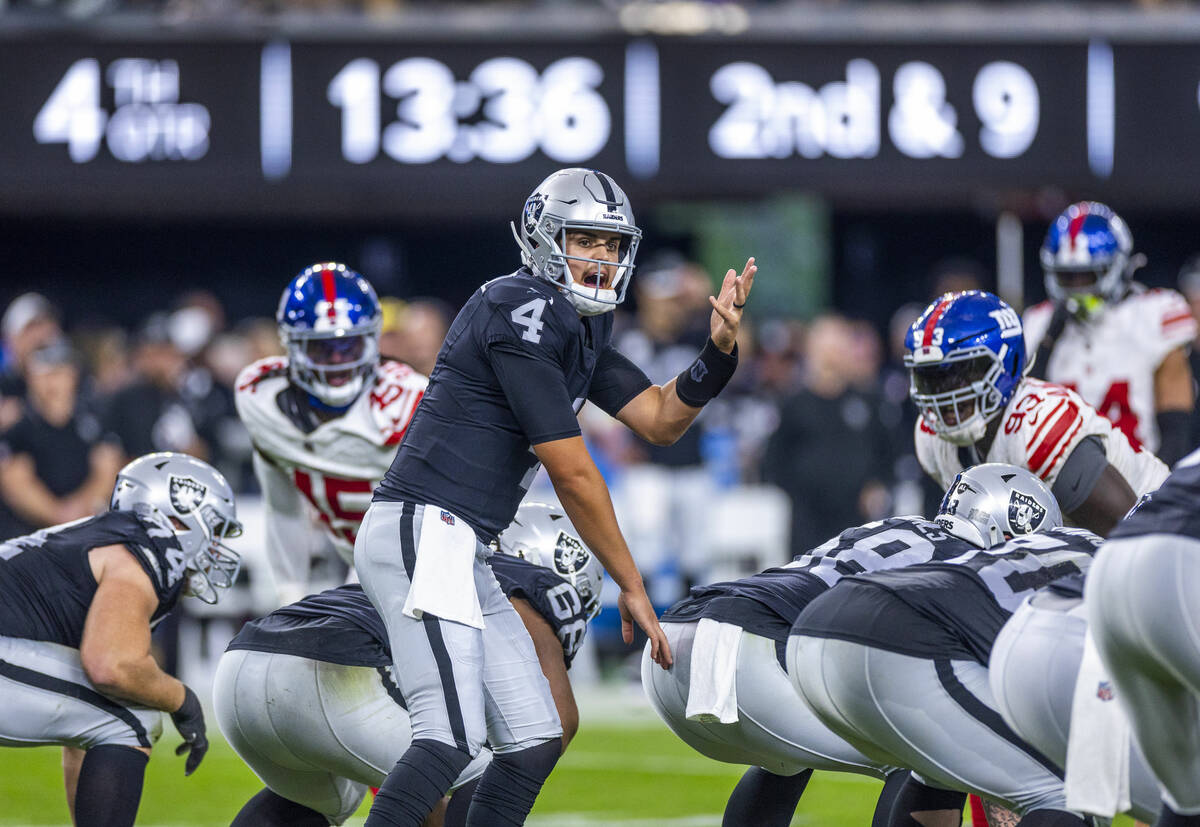 Raiders quarterback Aidan O'Connell (4) calls a play during the second half of their NFL game a ...