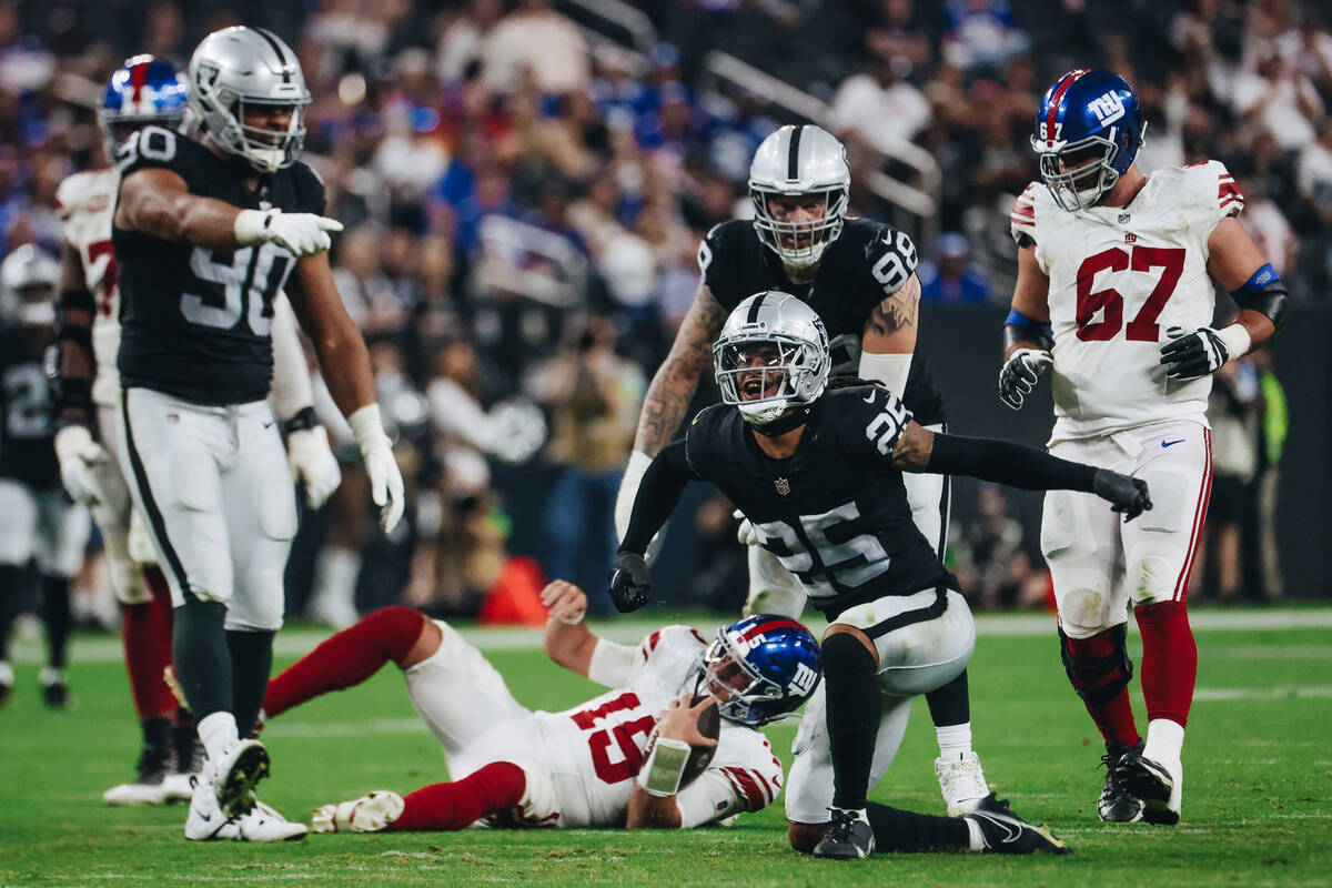 Raiders safety Tre'von Moehrig (25) celebrates taking down New York Giants quarterback Tommy De ...