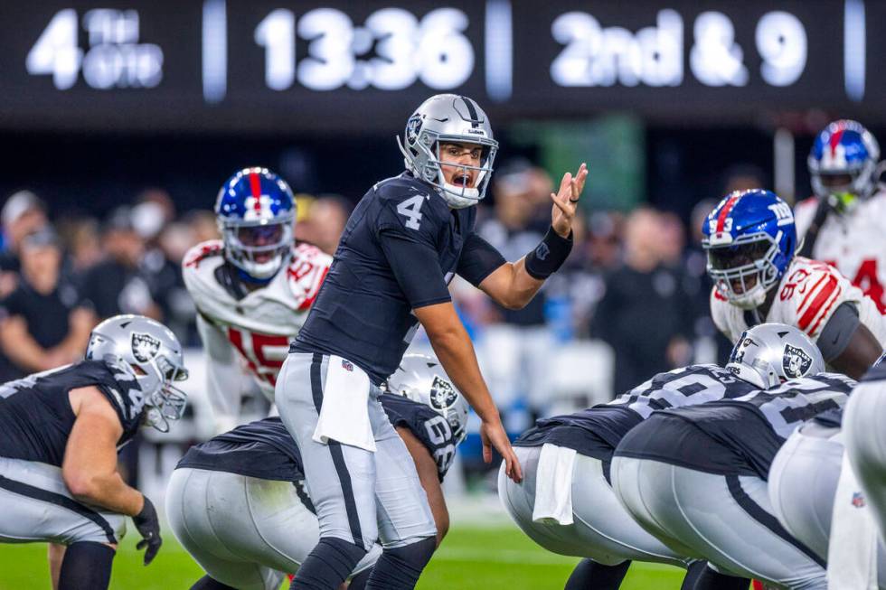 Raiders quarterback Aidan O'Connell (4) calls a play during the second half of their NFL game a ...