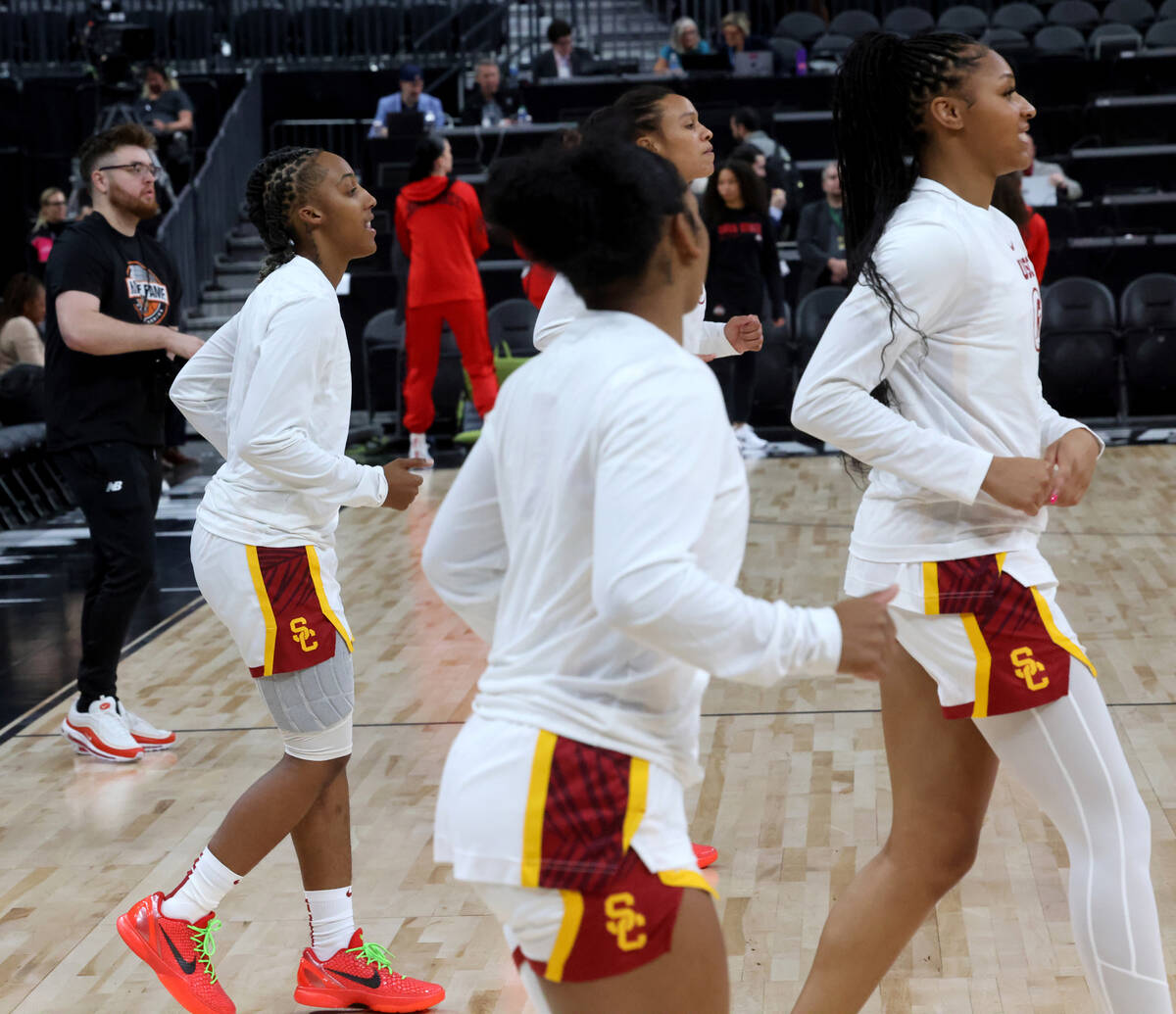 Spring Valley High basketball star Aaliyah Gayles, left, warms up with her USC teammates before ...