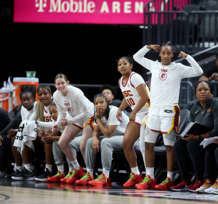 Former Spring Valley High basketball star Aaliyah Gayles, right, cheers with her USC teammates ...