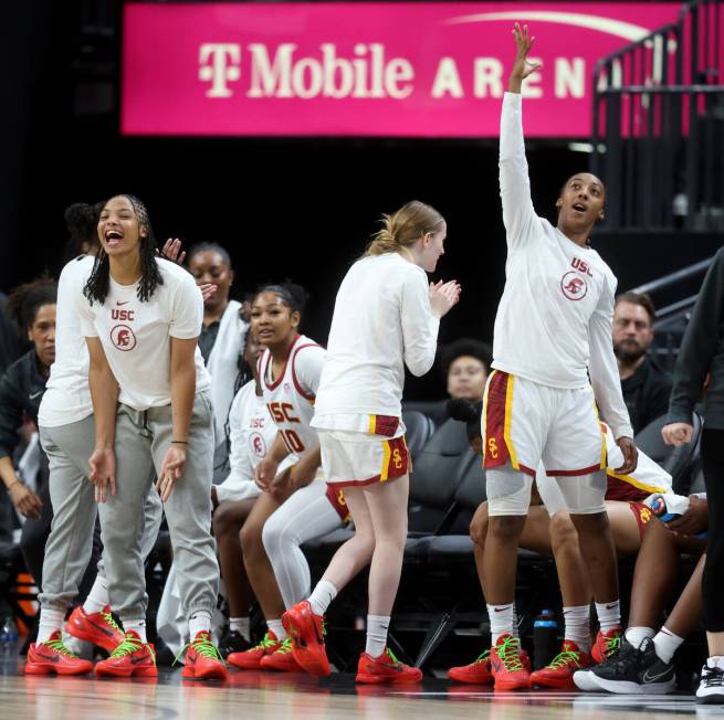 Former Spring Valley High basketball star Aaliyah Gayles, right, cheers with her USC teammates ...