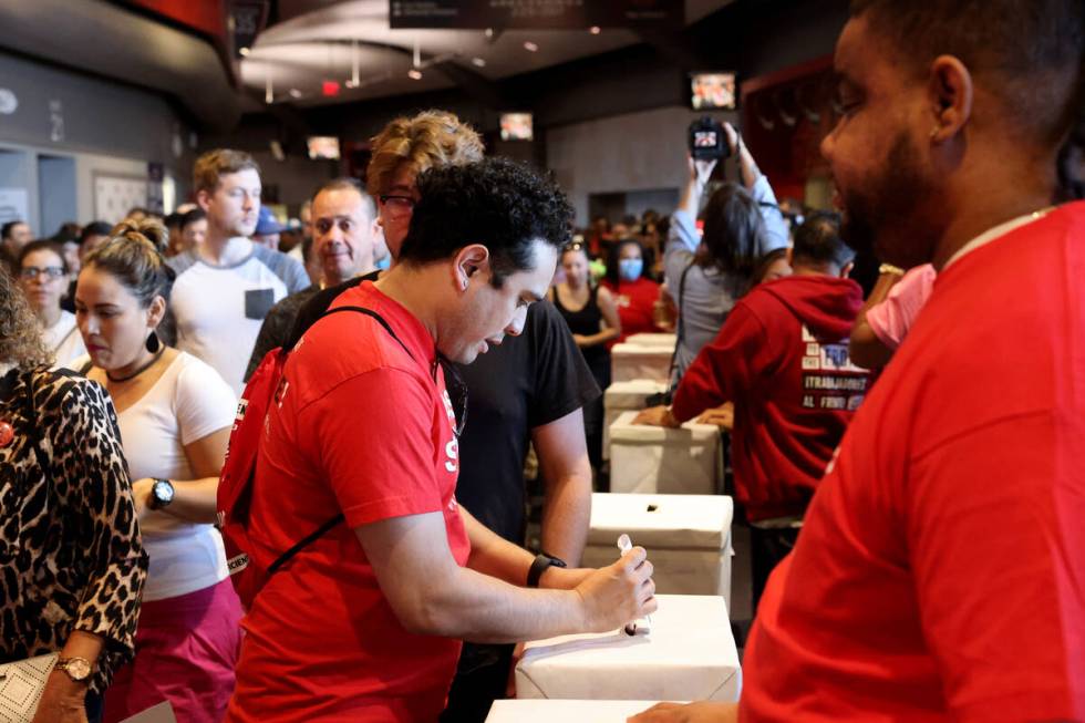 Culinary Union members cast their ballots during a strike vote at Thomas & Mack Center on the U ...