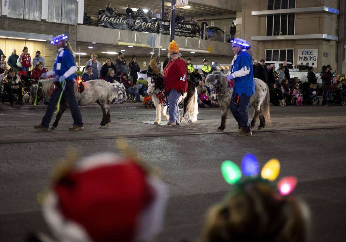 Ponies are part of the parade at Henderson's annual WinterFest in 2019 in Henderson. (Ellen Sch ...