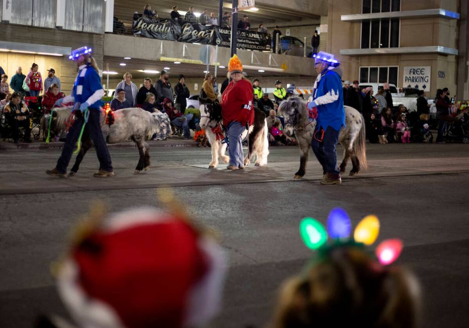 Ponies are part of the parade at Henderson's annual WinterFest in 2019 in Henderson. (Ellen Sch ...