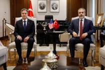 U.S. Secretary of State Antony Blinken (left) poses for a photograph with Turkish Foreign Minis ...