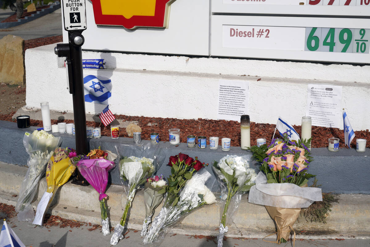 A makeshift shrine is placed at the scene of a Sunday confrontation that lead to death of a dem ...