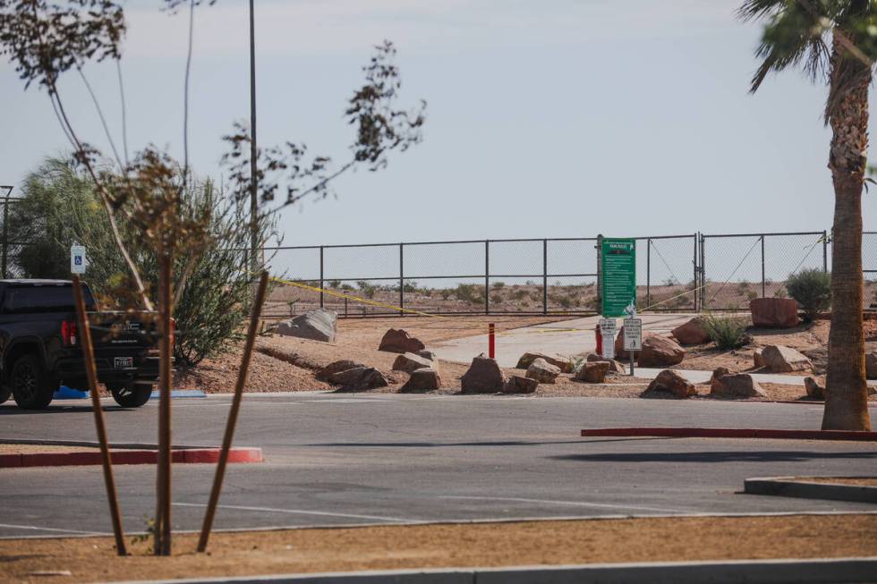 The scene where police are investigating a dead body found on the shared-use athletic fields be ...