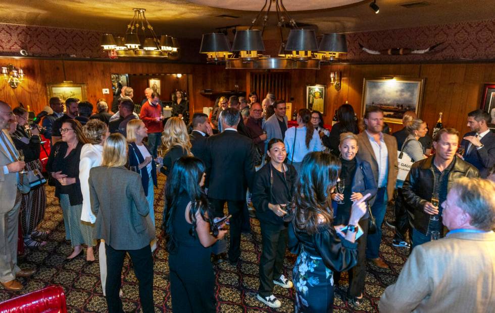 Guests mingle during an event to celebrate the first expansion in nearly 50 years at the Golden ...