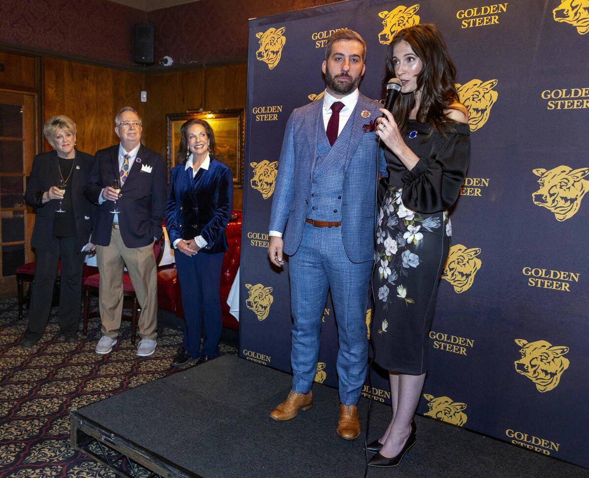 Restaurant managers Nick McMillan and Amanda Signorelli speak to guests during their event to c ...