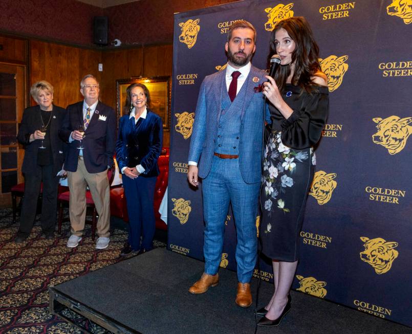 Restaurant managers Nick McMillan and Amanda Signorelli speak to guests during their event to c ...