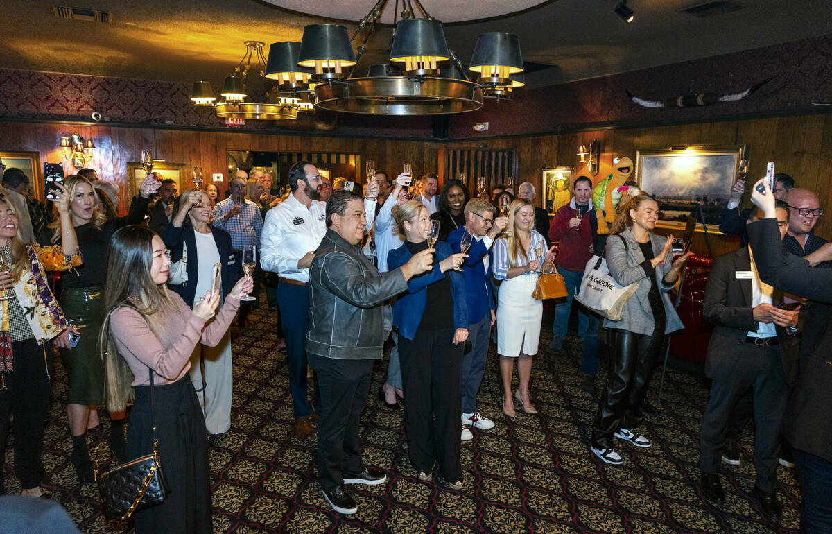 Guests share a toast during an event to celebrate the first expansion in nearly 50 years at the ...