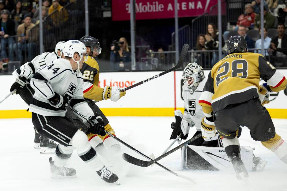 Kings goaltender Cam Talbot (39) saves the puck after Golden Knights right wing Michael Amadio ...