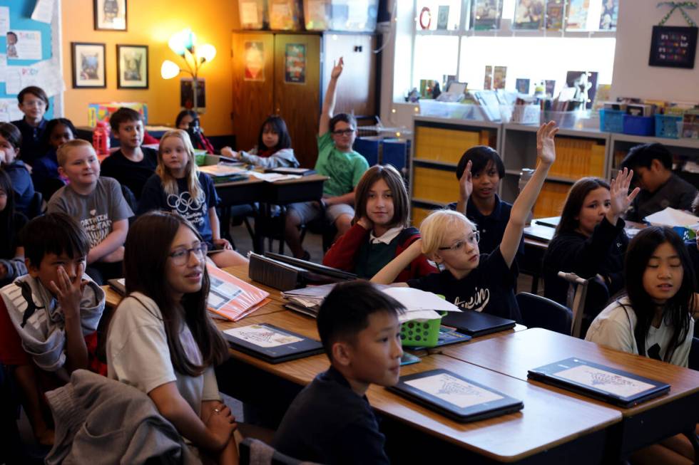 Ortwein Elementary fifth graders listen during a student’s monthly independence project ...