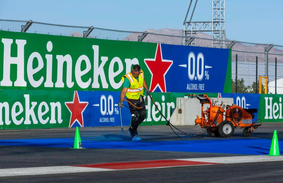 Turn one is painted with a logo about the Formula One Las Vegas Grand Prix pit building during ...