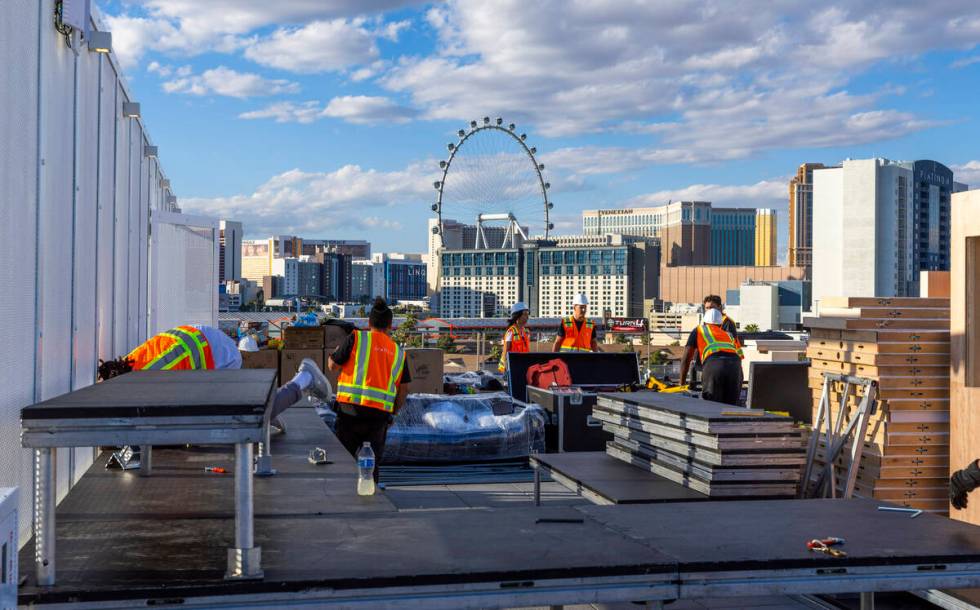 A construction crew continues the build on the rooftop of the Formula One Las Vegas Grand Prix ...