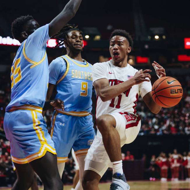 UNLV guard Dedan Thomas Jr. (11) loses the ball during a game against Southern at Thomas & ...