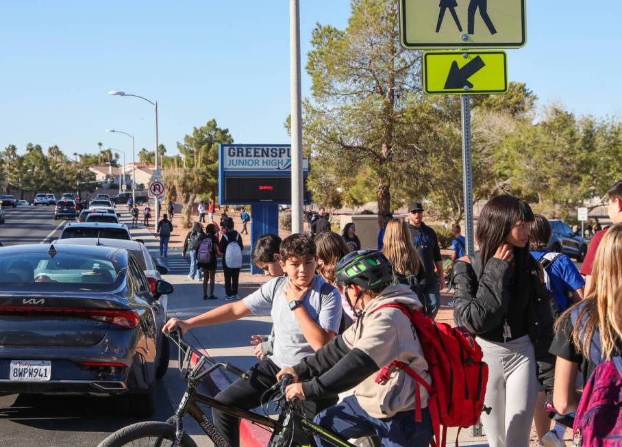 Middle School children cross Valle Verde Drive as they leave Greenspun Junior High School on Th ...