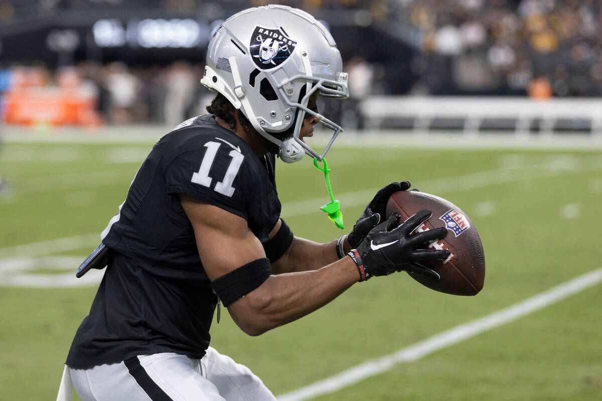 Raiders wide receiver Tre Tucker (11) makes a catch during warm ups before an NFL game against ...