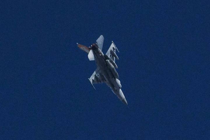 An Israeli jet fighter flies near the Gaza Strip, as seen from southern Israel, Friday, Nov. 10 ...