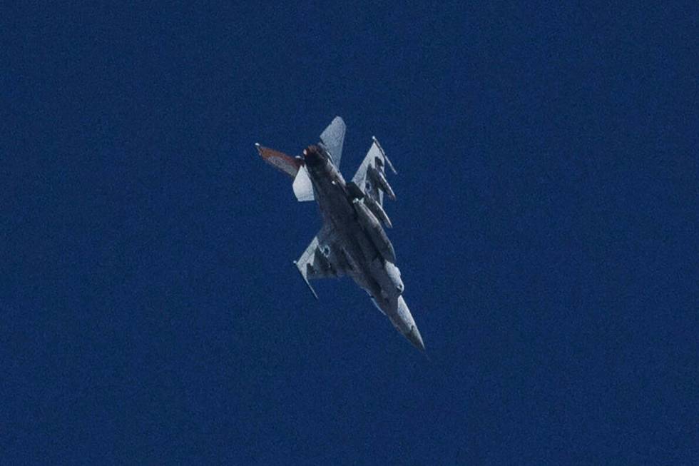 An Israeli jet fighter flies near the Gaza Strip, as seen from southern Israel, Friday, Nov. 10 ...