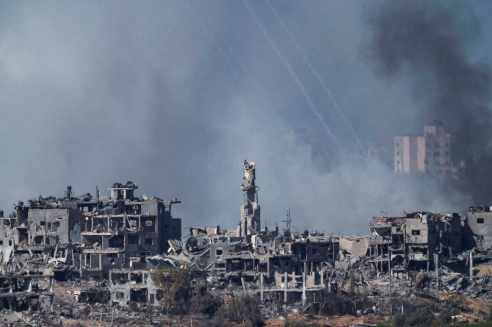 Smoke rises following an Israeli airstrike in the Gaza Strip, as seen from southern Israel, Fri ...