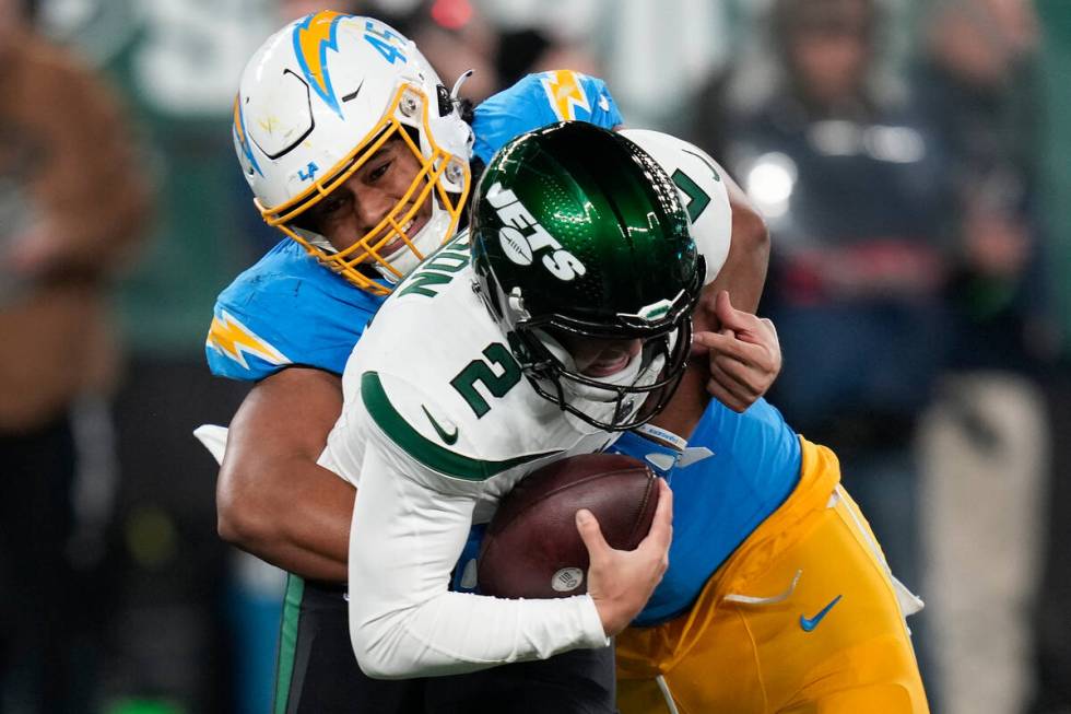 Los Angeles Chargers linebacker Tuli Tuipulotu (45) sacks New York Jets quarterback Zach Wilson ...