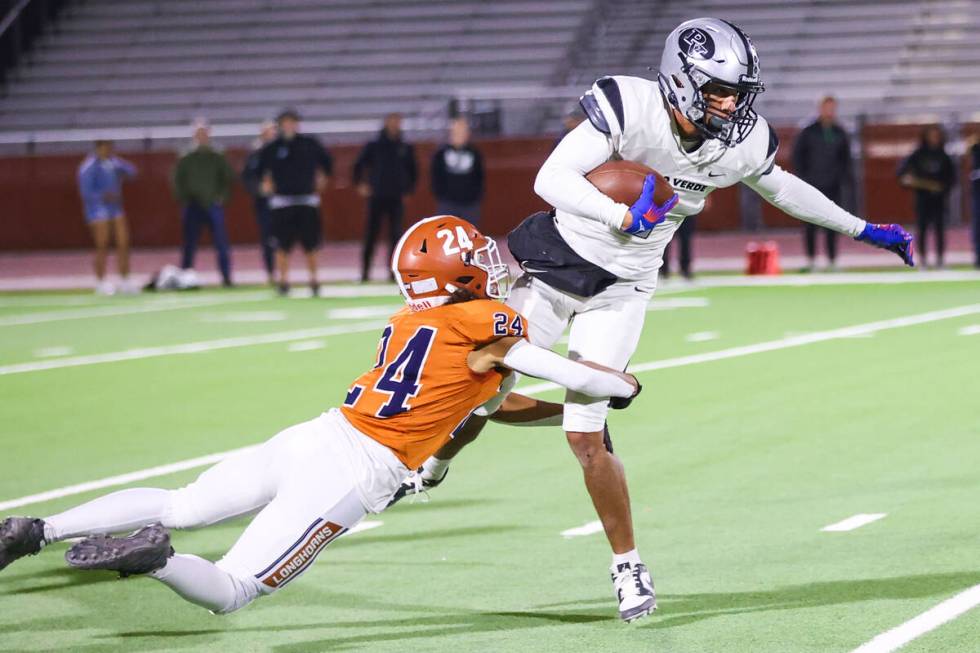 Legacy’s Anthony Hern (24) tackles a Palo Verde player who is carrying the ball during t ...