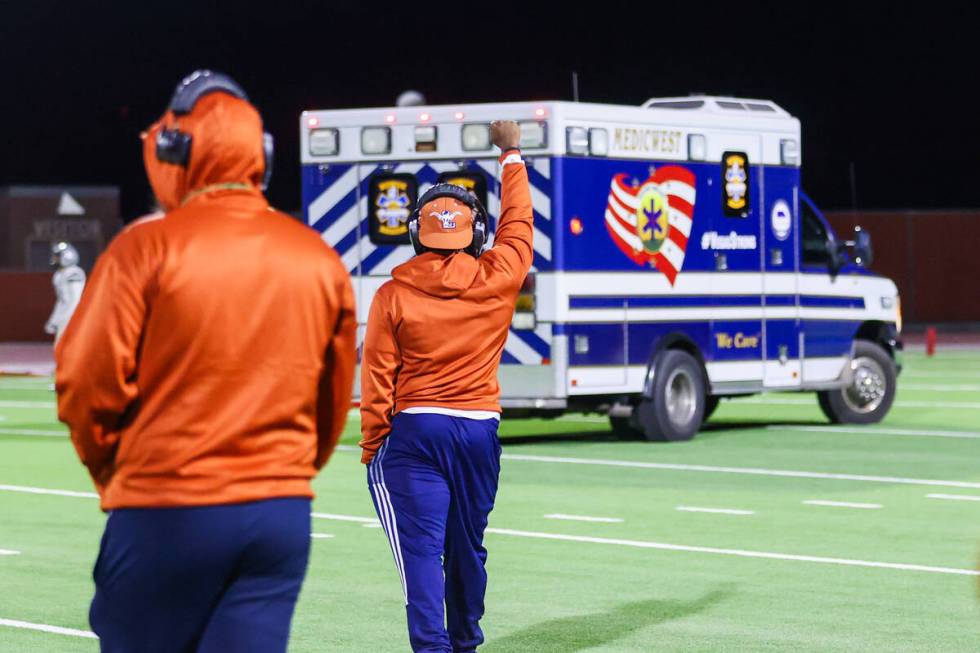 Legacy coaches watch and salute their player, Dominic Oliver (1), as he is driven away by param ...