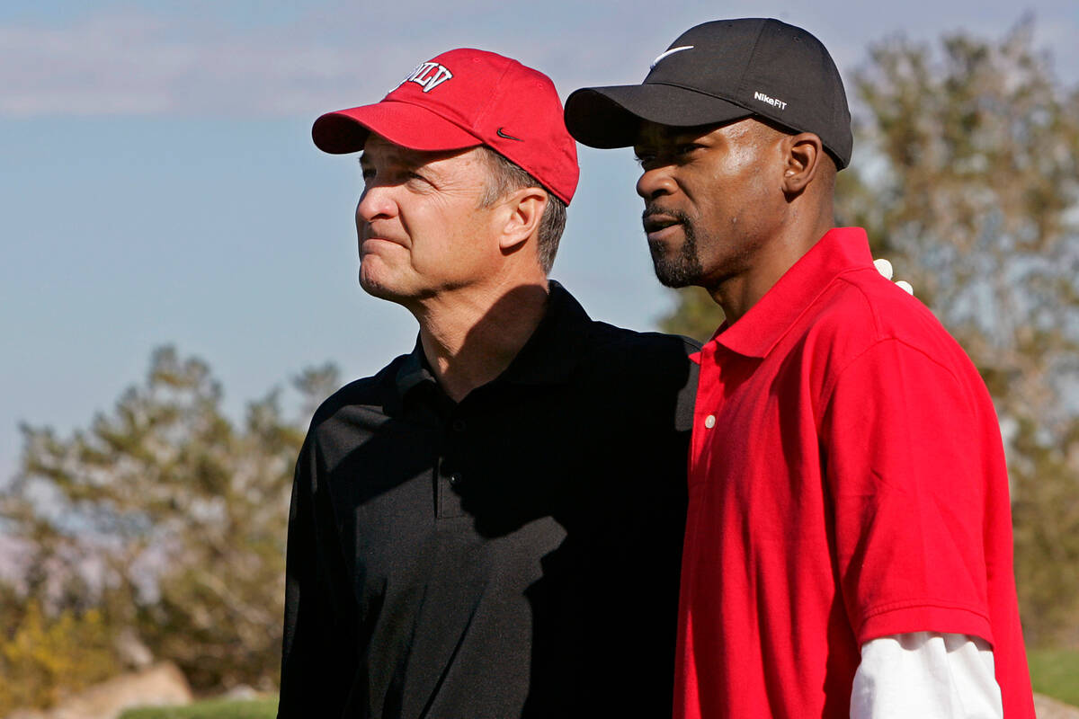 UNLV basketball coach Lon Kruger, left, stands with former UNLV basketball player Anderson Hunt ...