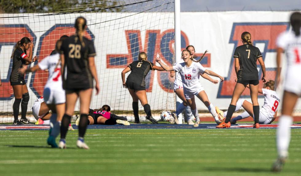 Coronado players celebrate their first goal against Faith Lutheran during the first half of the ...