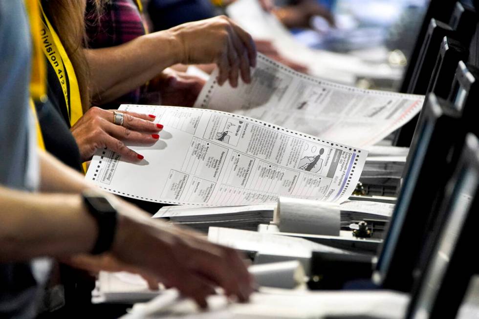 FILE – Election workers at the Allegheny County Election Division warehouse in Pittsburg ...