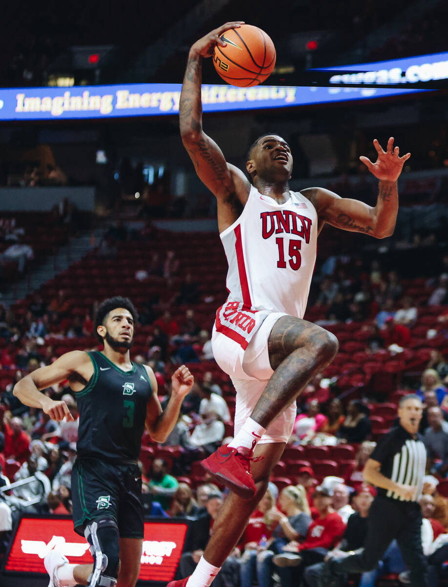 UNLV guard Luis Rodriguez (15) goes for a layup during a game against Stetson at Thomas & M ...