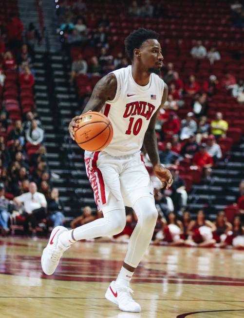 UNLV forward Kalib Boone (10) dribbles the ball during a game against Stetson at Thomas & M ...